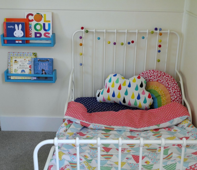 IKEA hack shelves and colourful toddler room