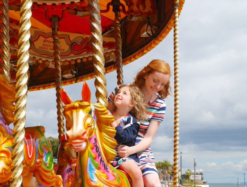 Carousel ride on holiday - tips for stress-free train travel with small children