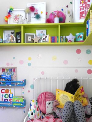 Colourful children's bedrooms with painted book shelves and wall stickers